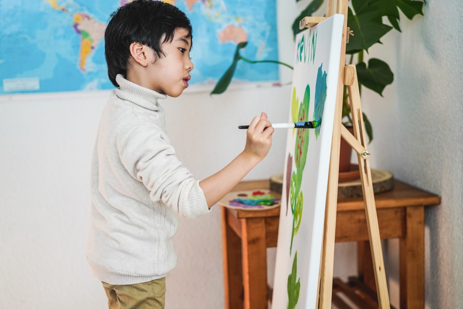 Boy child learning art lesson at preschool - Focus on face